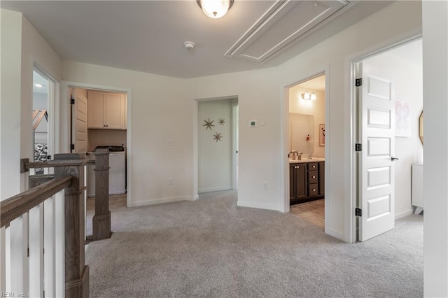 interior space featuring light carpet and sink