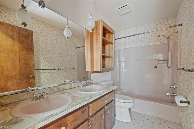 full bathroom with tile patterned flooring, vanity, washtub / shower combination, and toilet