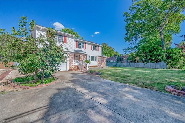 view of front of property featuring a garage and a front lawn