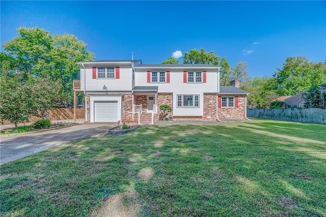 view of front of home with a front lawn and a garage