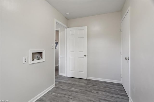 corridor with dark wood-type flooring