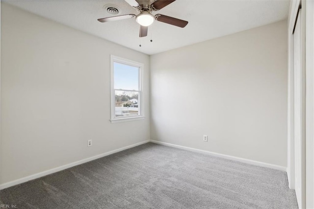 carpeted empty room with ceiling fan