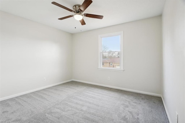 empty room featuring carpet and ceiling fan