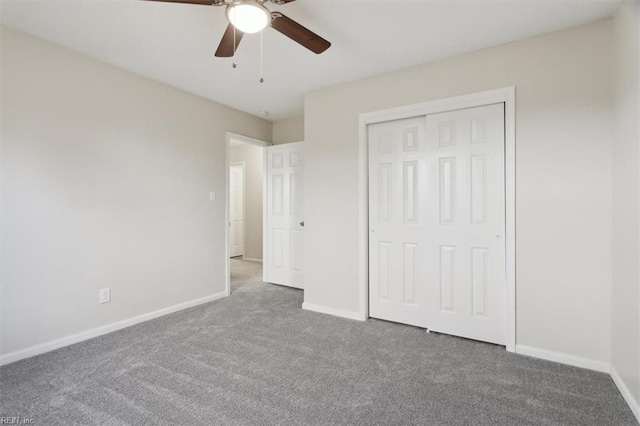 unfurnished bedroom featuring carpet flooring, a closet, and ceiling fan