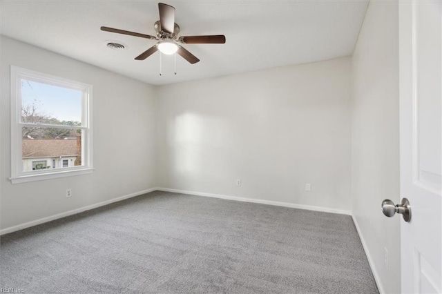 unfurnished room featuring ceiling fan and carpet floors