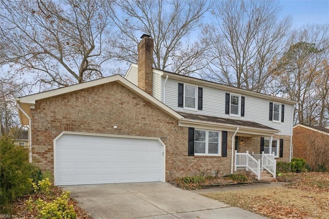 view of front property featuring covered porch and a garage