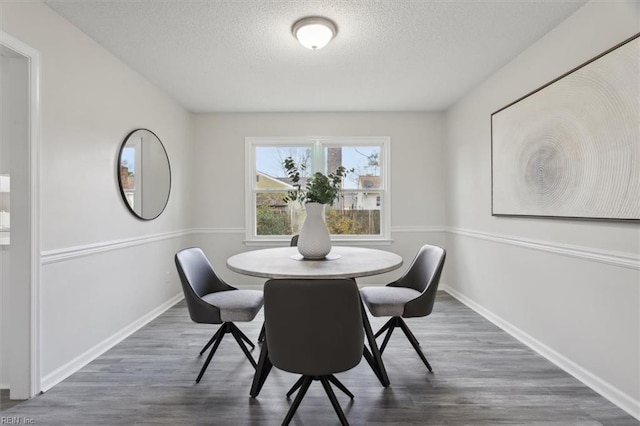 dining space with dark wood-type flooring