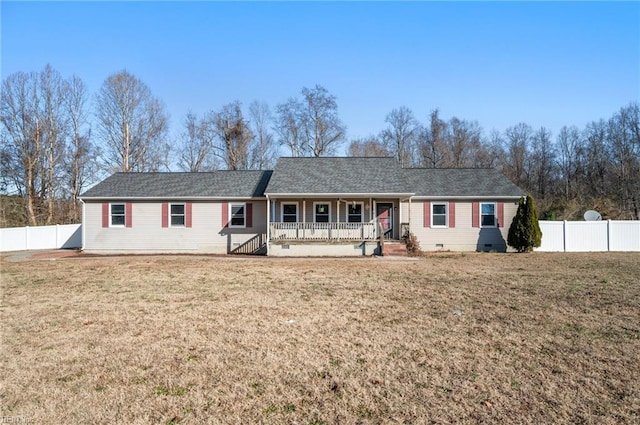 ranch-style house featuring a front lawn and covered porch