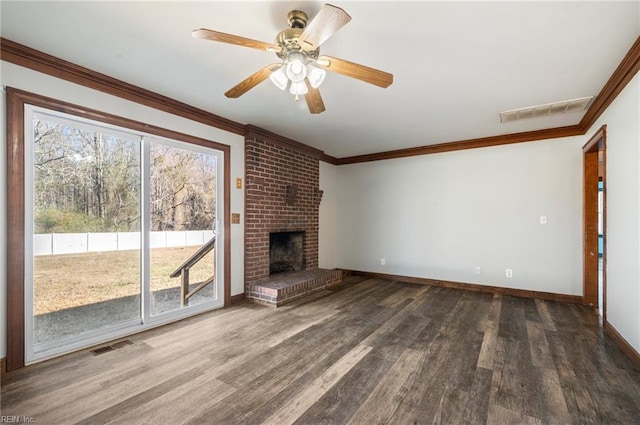 unfurnished living room with a wealth of natural light, a fireplace, ceiling fan, and dark wood-type flooring