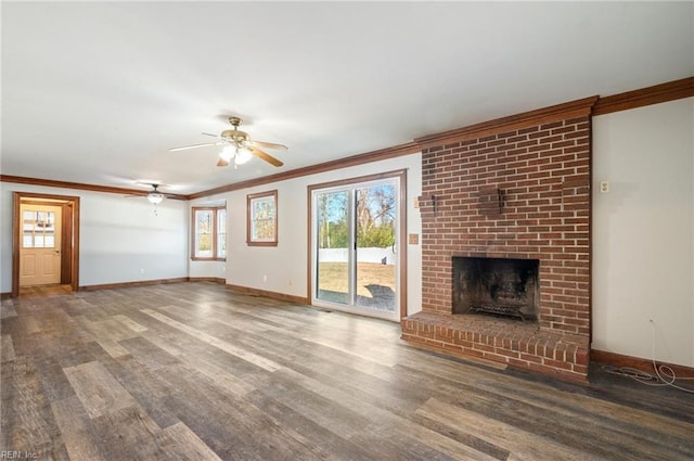 unfurnished living room with a fireplace, hardwood / wood-style floors, ceiling fan, and crown molding