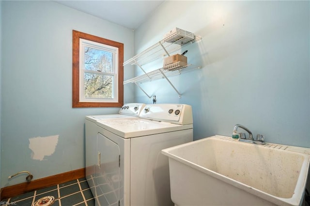 clothes washing area with sink and washing machine and clothes dryer