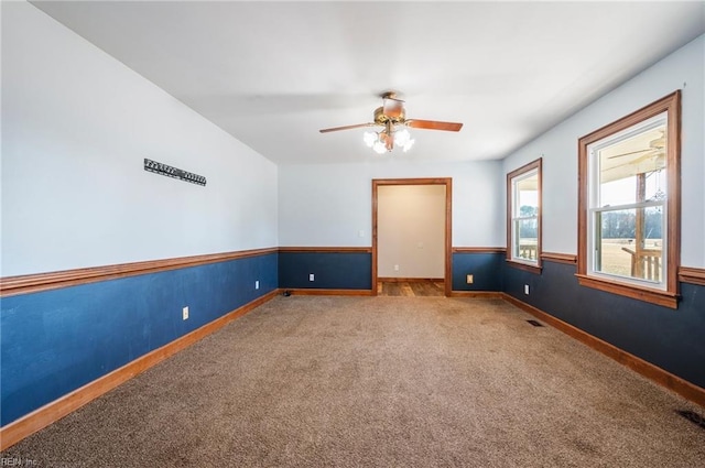 carpeted empty room with ceiling fan