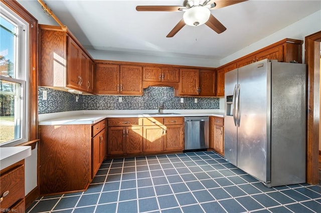 kitchen featuring ceiling fan, sink, a healthy amount of sunlight, and appliances with stainless steel finishes