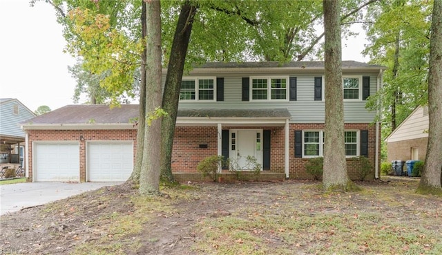 view of front of property with a porch and a garage