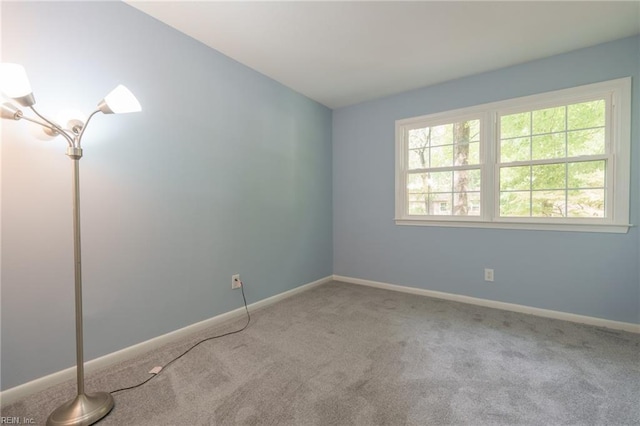 unfurnished room with carpet floors