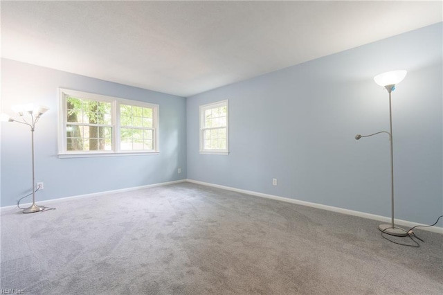 unfurnished room featuring carpet