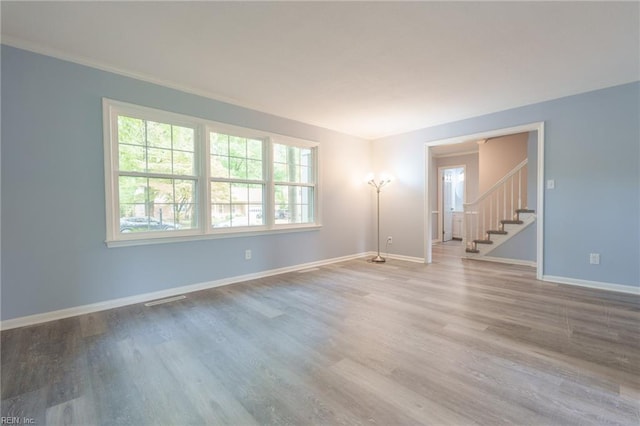 spare room featuring light hardwood / wood-style floors