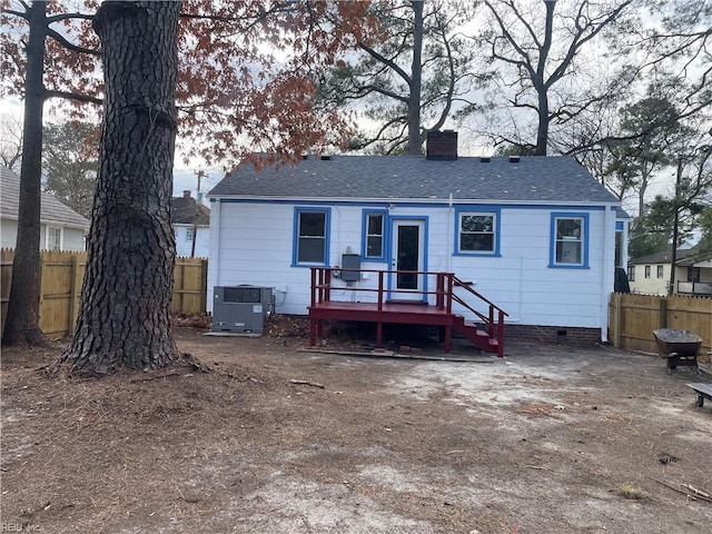 rear view of house with central AC