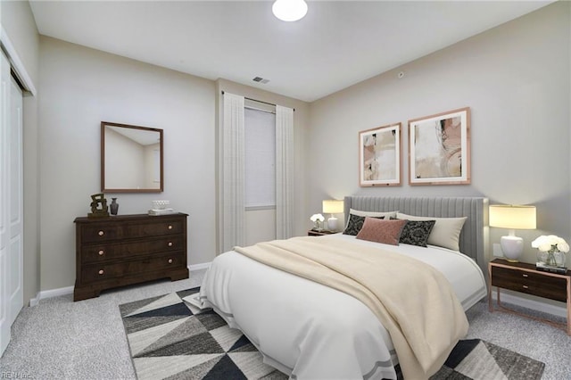 carpeted bedroom featuring a closet