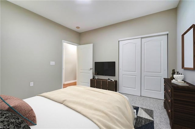 carpeted bedroom with a closet