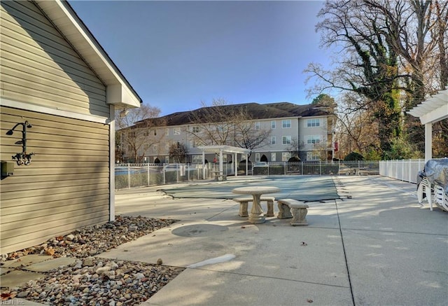 view of patio / terrace featuring a covered pool