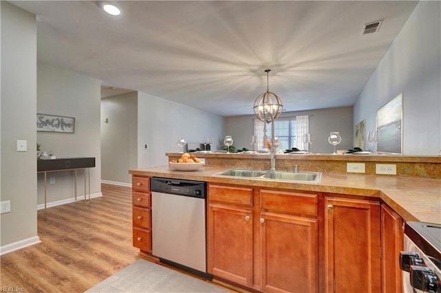 kitchen with sink, stainless steel dishwasher, a notable chandelier, decorative light fixtures, and range