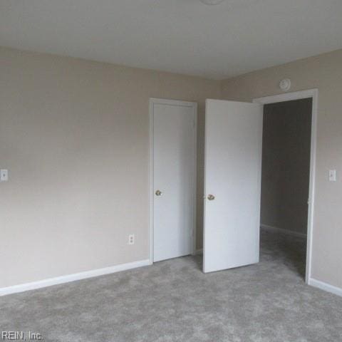 unfurnished bedroom featuring light colored carpet