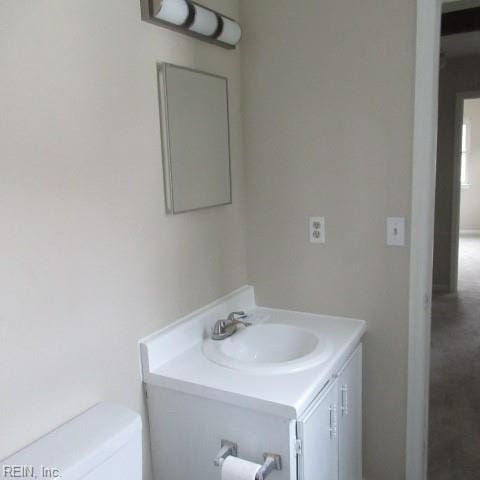 bathroom with vanity and toilet