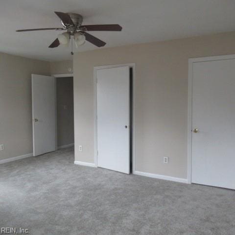 unfurnished bedroom with carpet flooring and ceiling fan