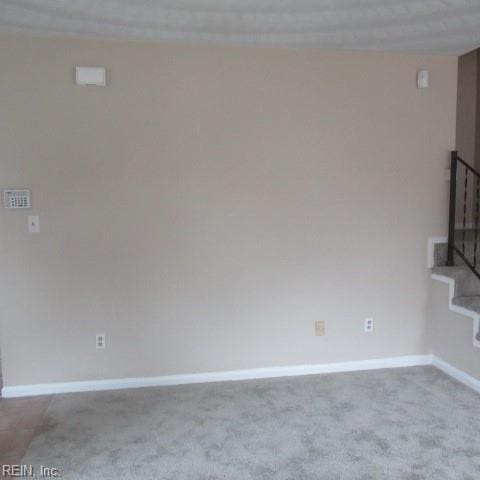 empty room featuring light colored carpet