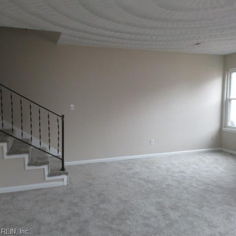 unfurnished room featuring carpet flooring