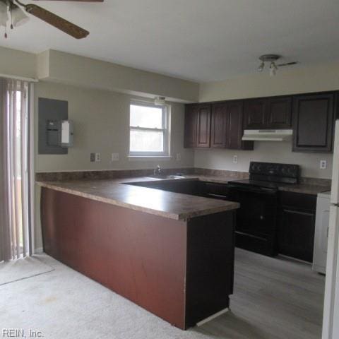 kitchen with electric range, dark brown cabinets, ceiling fan, and sink