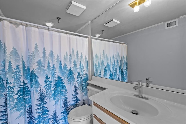 bathroom featuring vanity, toilet, and crown molding