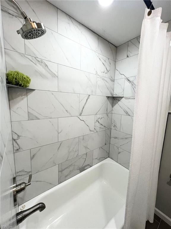 bathroom featuring shower / bathtub combination with curtain