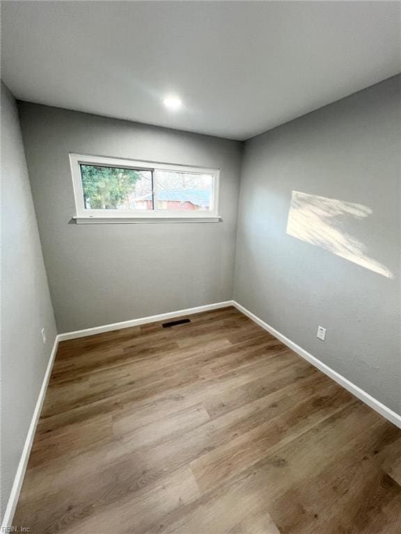 unfurnished room with light hardwood / wood-style flooring