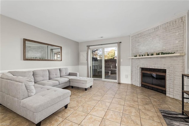 living room featuring a fireplace and light tile patterned floors