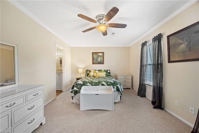 carpeted bedroom featuring ceiling fan, crown molding, and ensuite bath