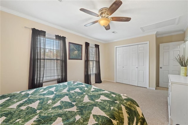 bedroom featuring light carpet, a closet, ceiling fan, and crown molding