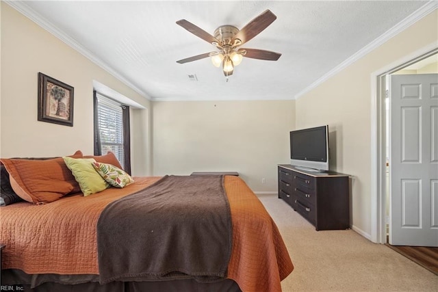 carpeted bedroom with ceiling fan and crown molding