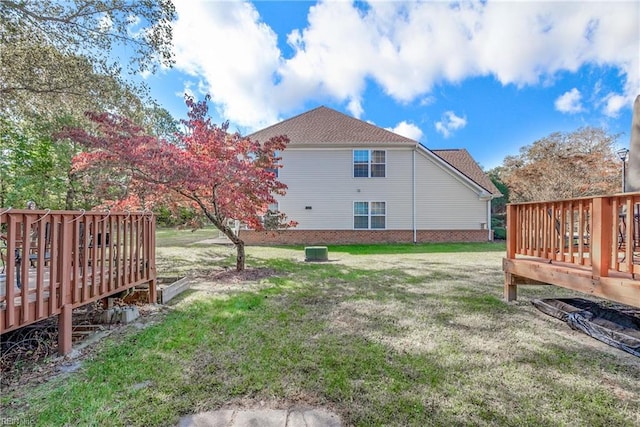 view of yard with a wooden deck