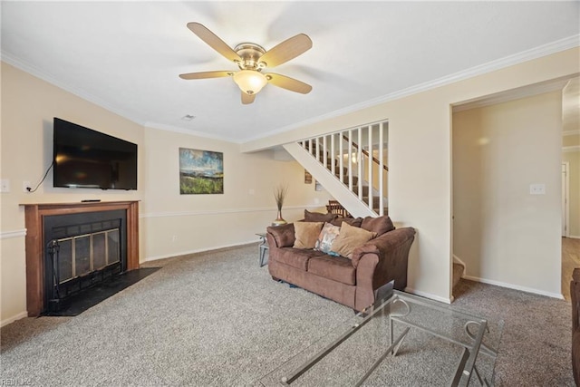 carpeted living room featuring ceiling fan and crown molding