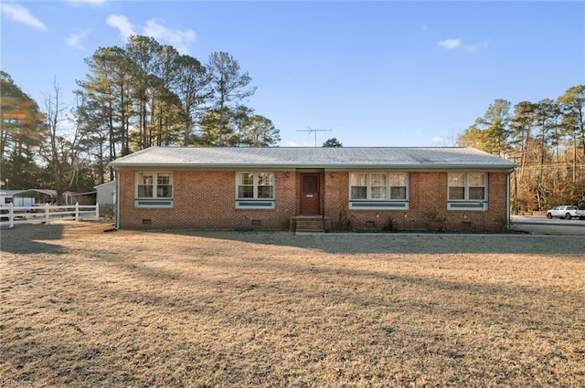 ranch-style home with a front yard