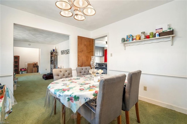 view of carpeted dining area