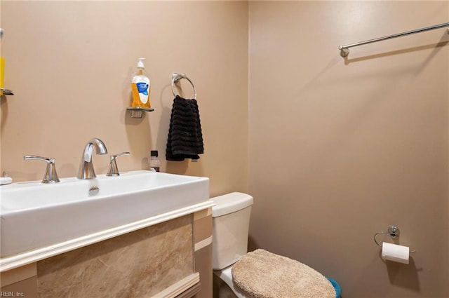 bathroom with toilet and sink