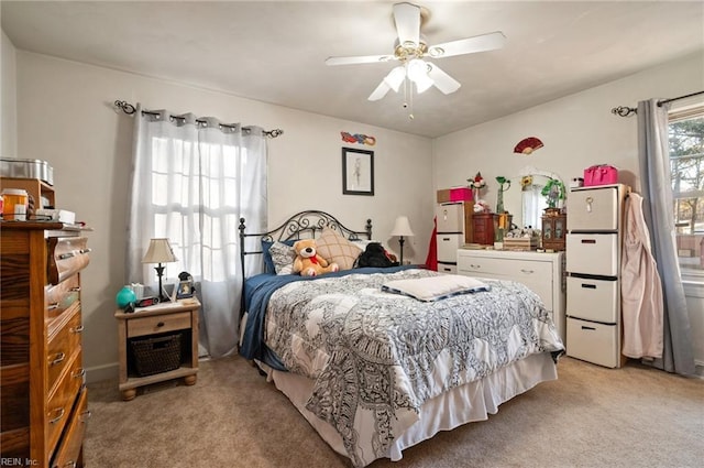 carpeted bedroom featuring ceiling fan