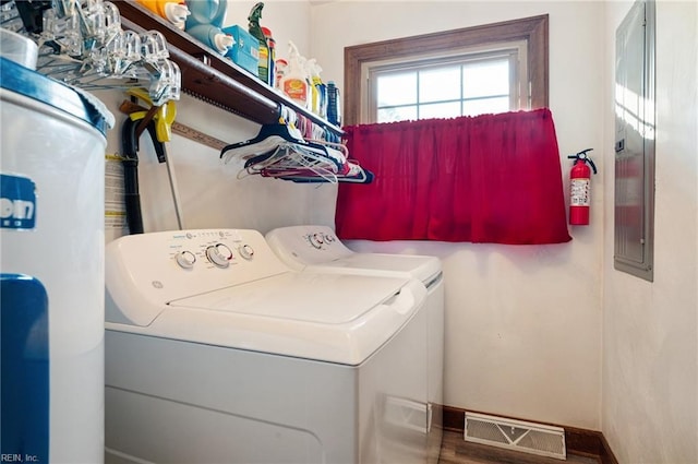 clothes washing area featuring independent washer and dryer