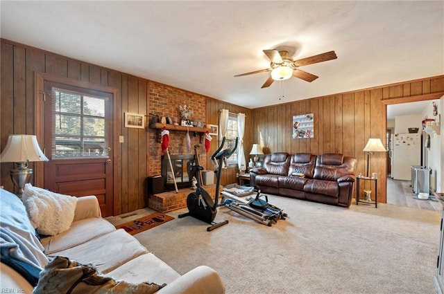 carpeted living room with ceiling fan