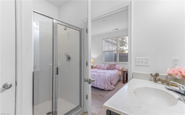 bathroom featuring vanity and a shower with shower door