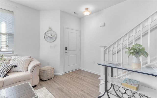 living room with light hardwood / wood-style floors