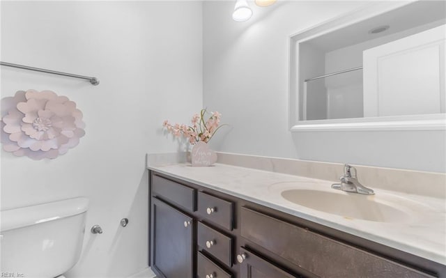 bathroom with vanity and toilet